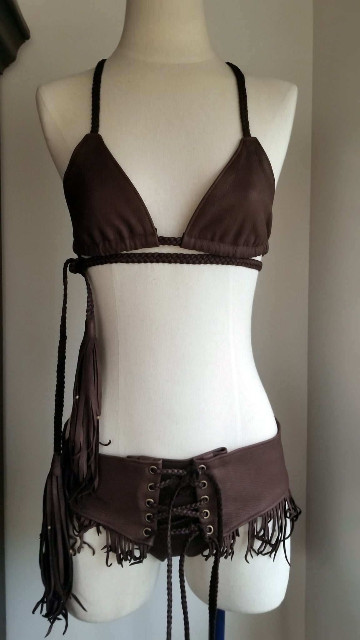 leather bikini set, deerskin leather boy booty shorts bottoms, triangle leather top with braided leather ties and straps, tassels and african beads, chocolate brown on mannequin