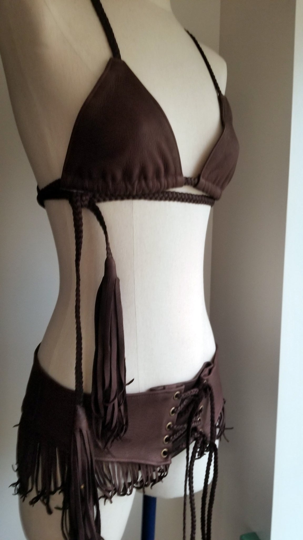 leather bikini set, deerskin leather boy booty shorts bottoms, triangle leather top with braided leather ties and straps, tassels and african beads, chocolate brown on mannequin