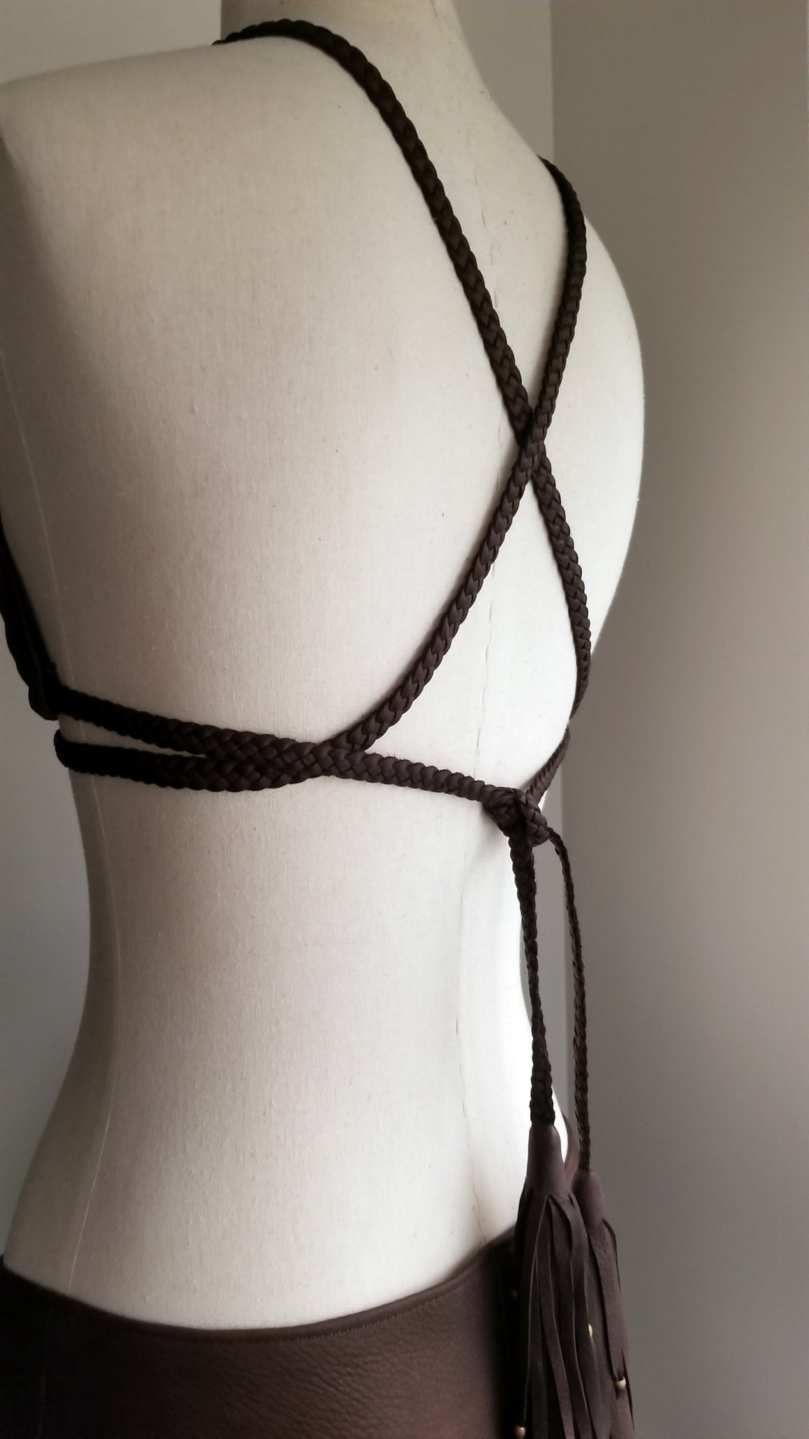 leather bikini set, deerskin leather boy booty shorts bottoms, triangle leather top with braided leather ties and straps, tassels and african beads, chocolate brown on mannequin