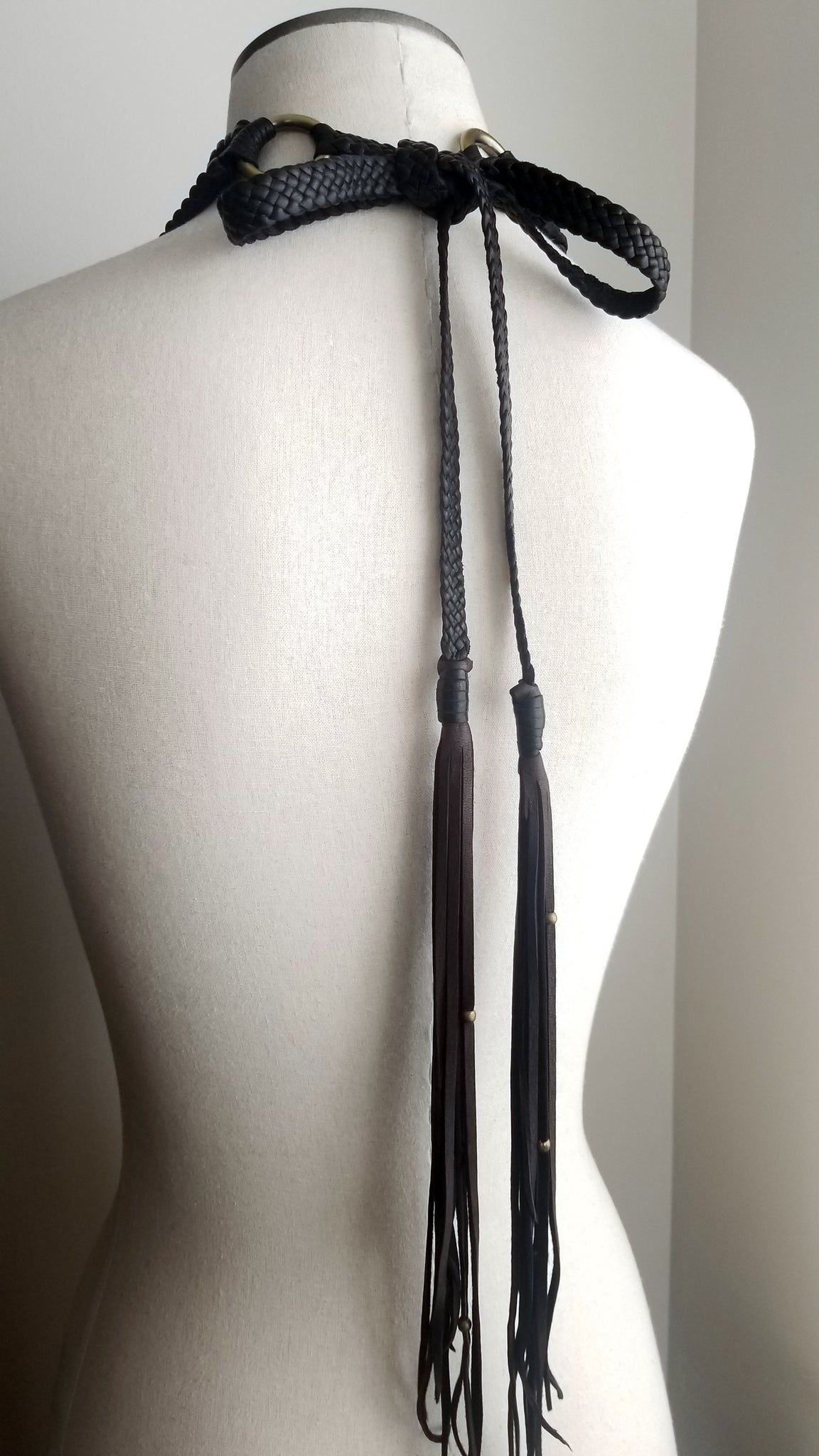 Back of Zanta African Inspired, Braided Leather Statement Necklace, Bib Neckpiece, woven collar, fringe and tassels, on a dress form