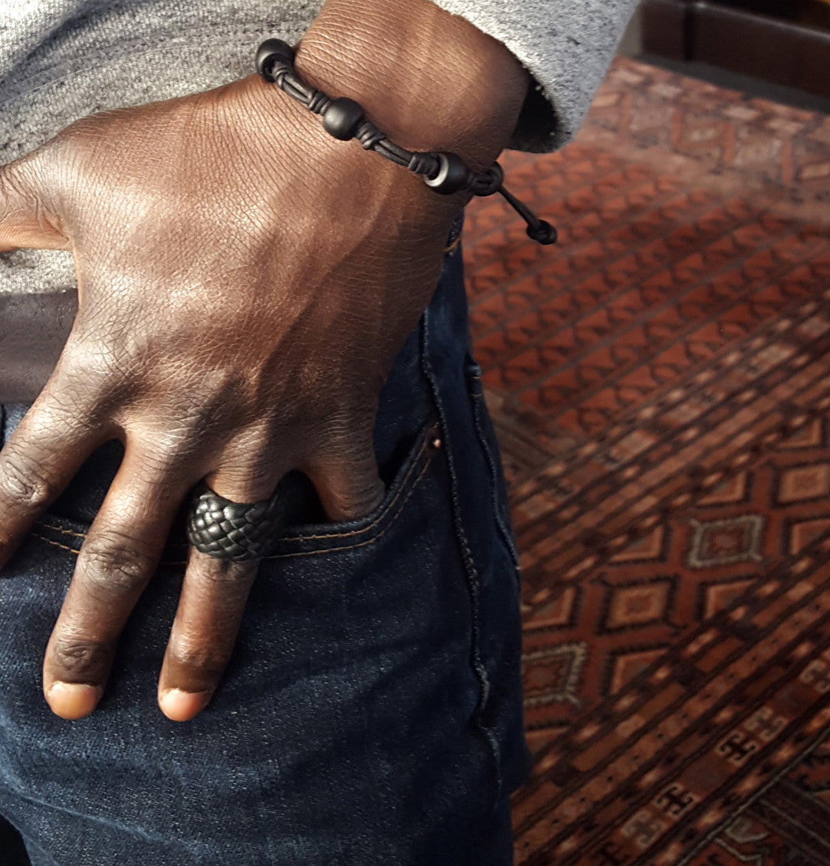 antique black African Trade Padre Posser Beads on a Black Leather Cord - Adjustable Stackable Bracelet on male model