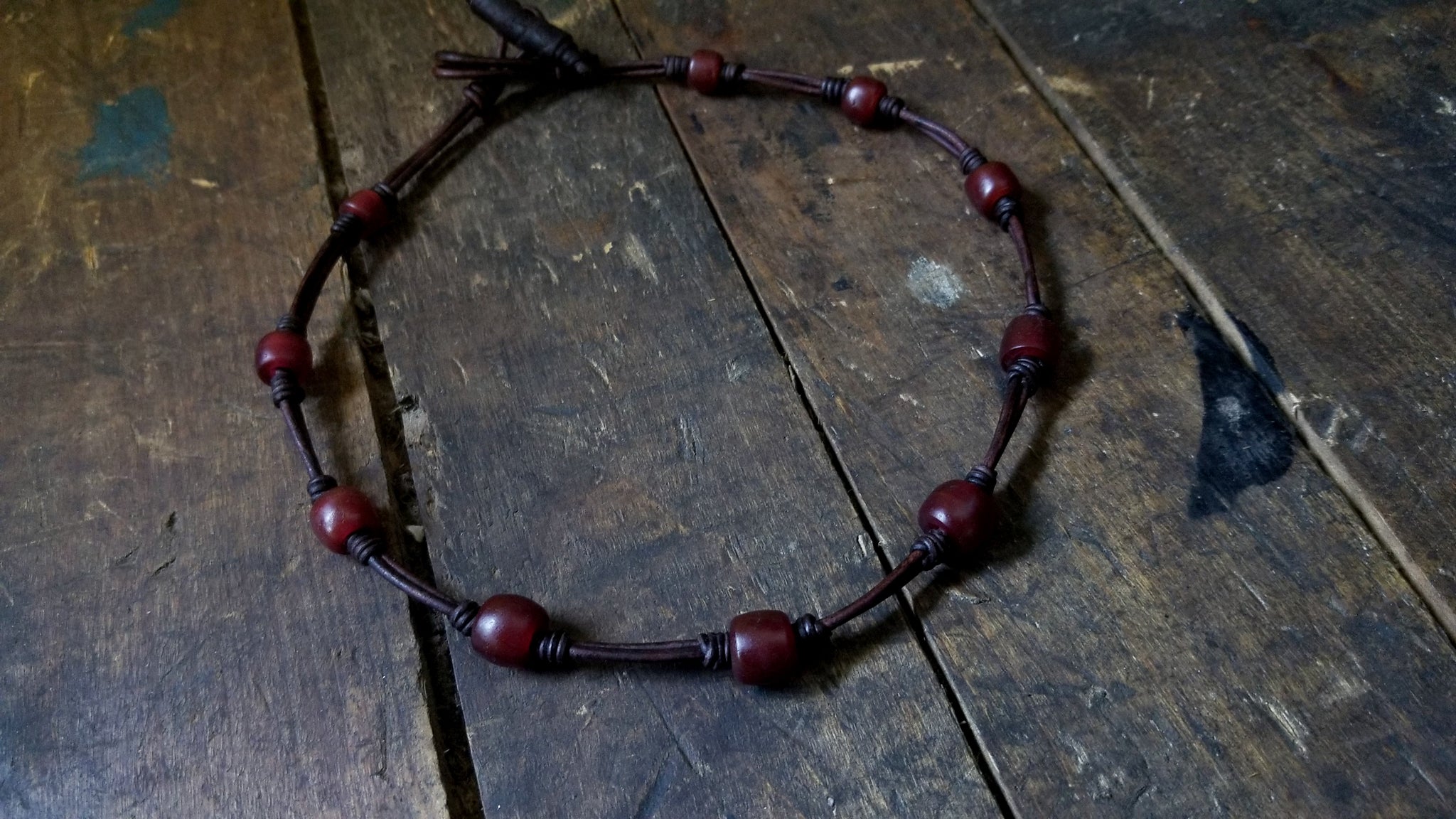 Chuma Leather Necklace; antique chocolate brown leather cord with mahogany Brown African Trade Beads, Bison Leather Toggle Button and Loop Clasp