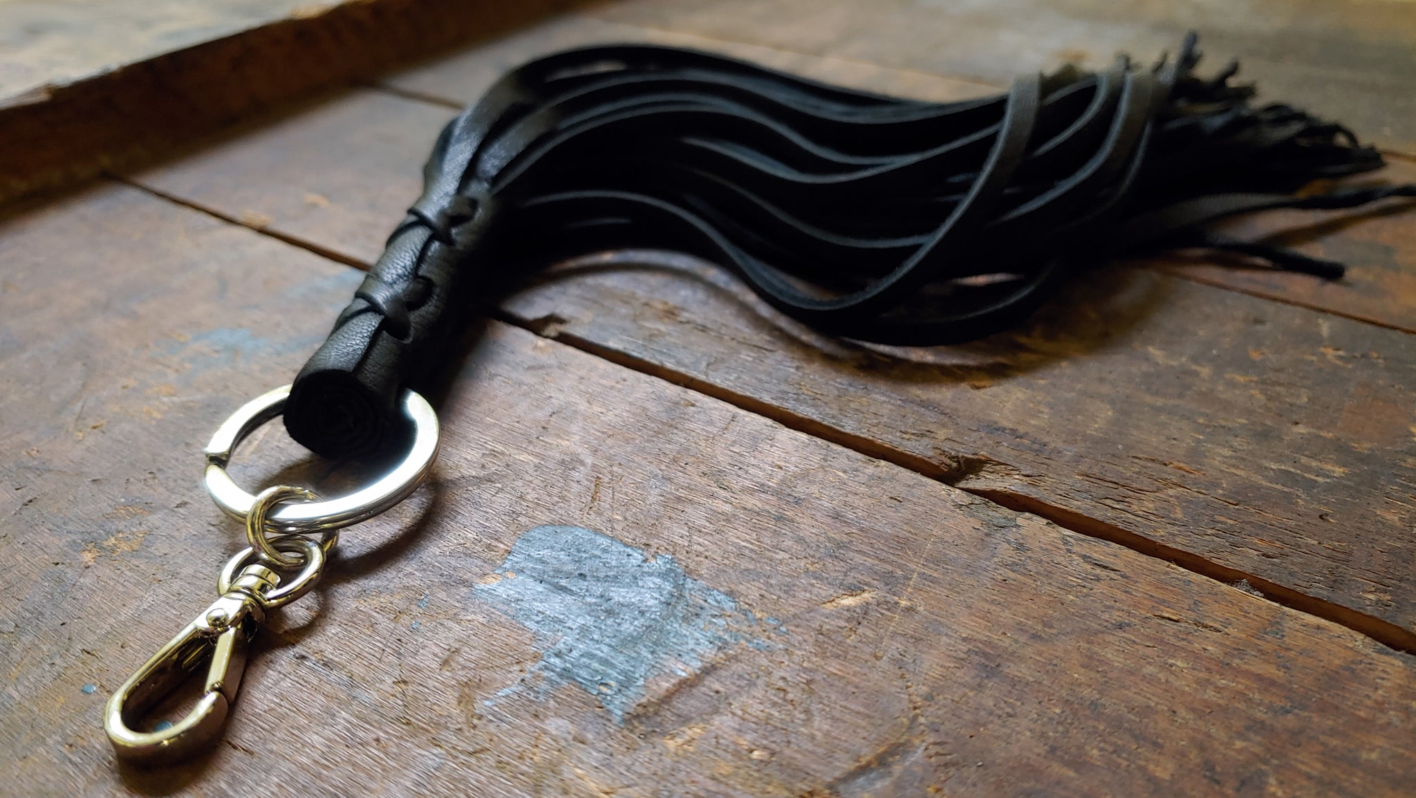 Nala Luxury Leather Tassel Key Chain in black deerskin with silver clip