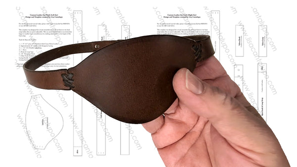 Brown leather eye patch held by a hand with technical drawings in the background