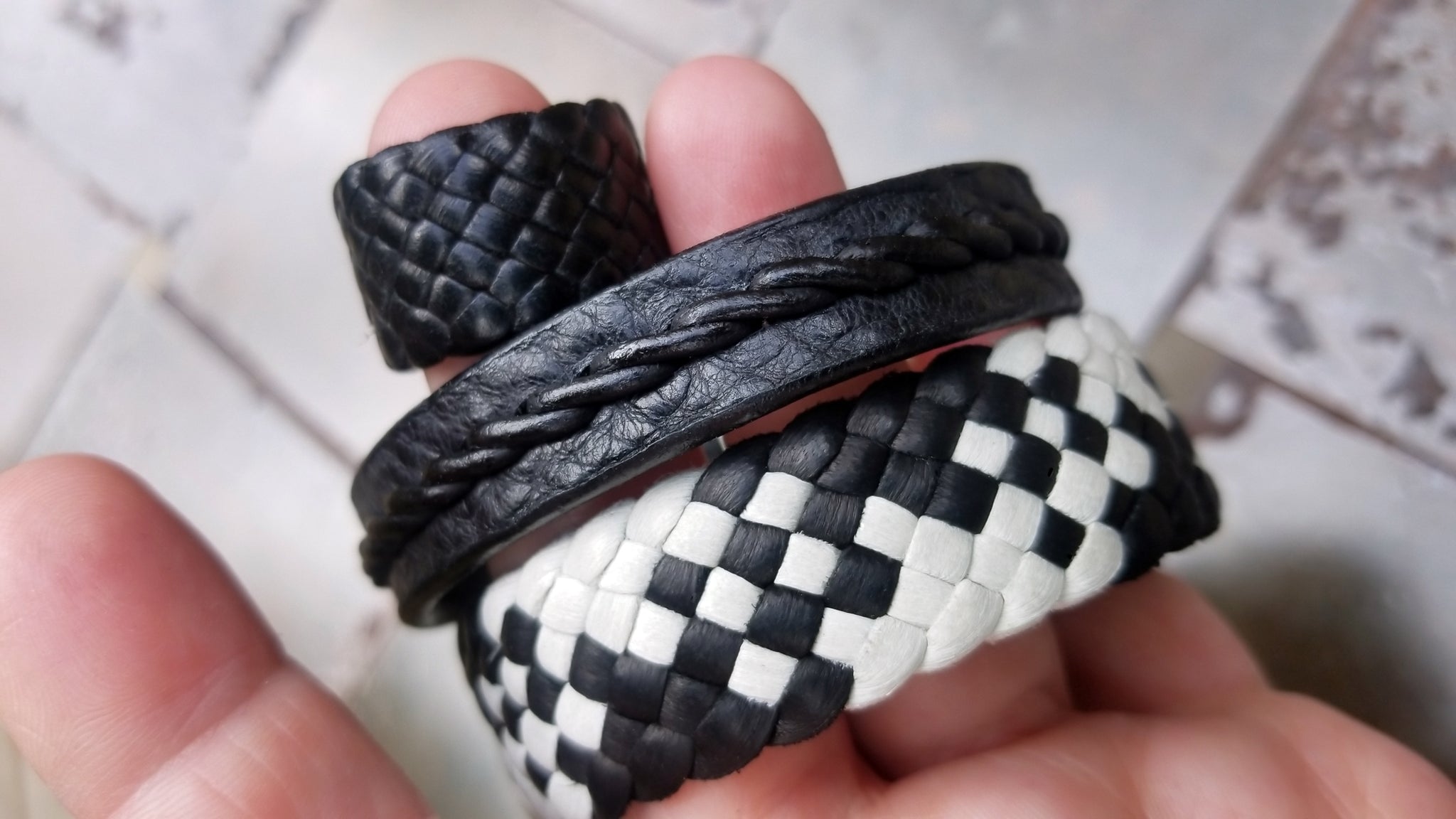Tyrese Twist Braided Leather Bracelet in Mayo and Black, paired with 3/4" Kama Braided leather Ring (black) and Mayonnaise and Black Amari Braided Leather Bracelet