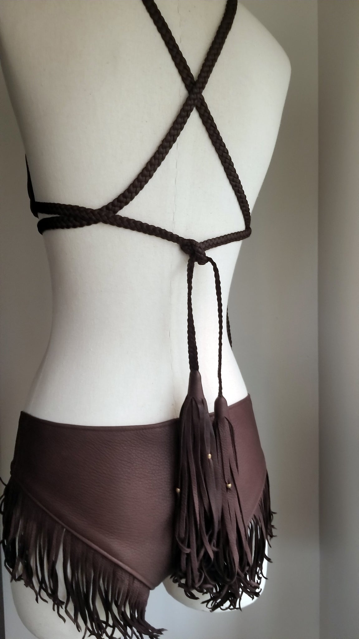 leather bikini set, deerskin leather boy booty shorts bottoms, triangle leather top with braided leather ties and straps, tassels and african beads, chocolate brown on mannequin