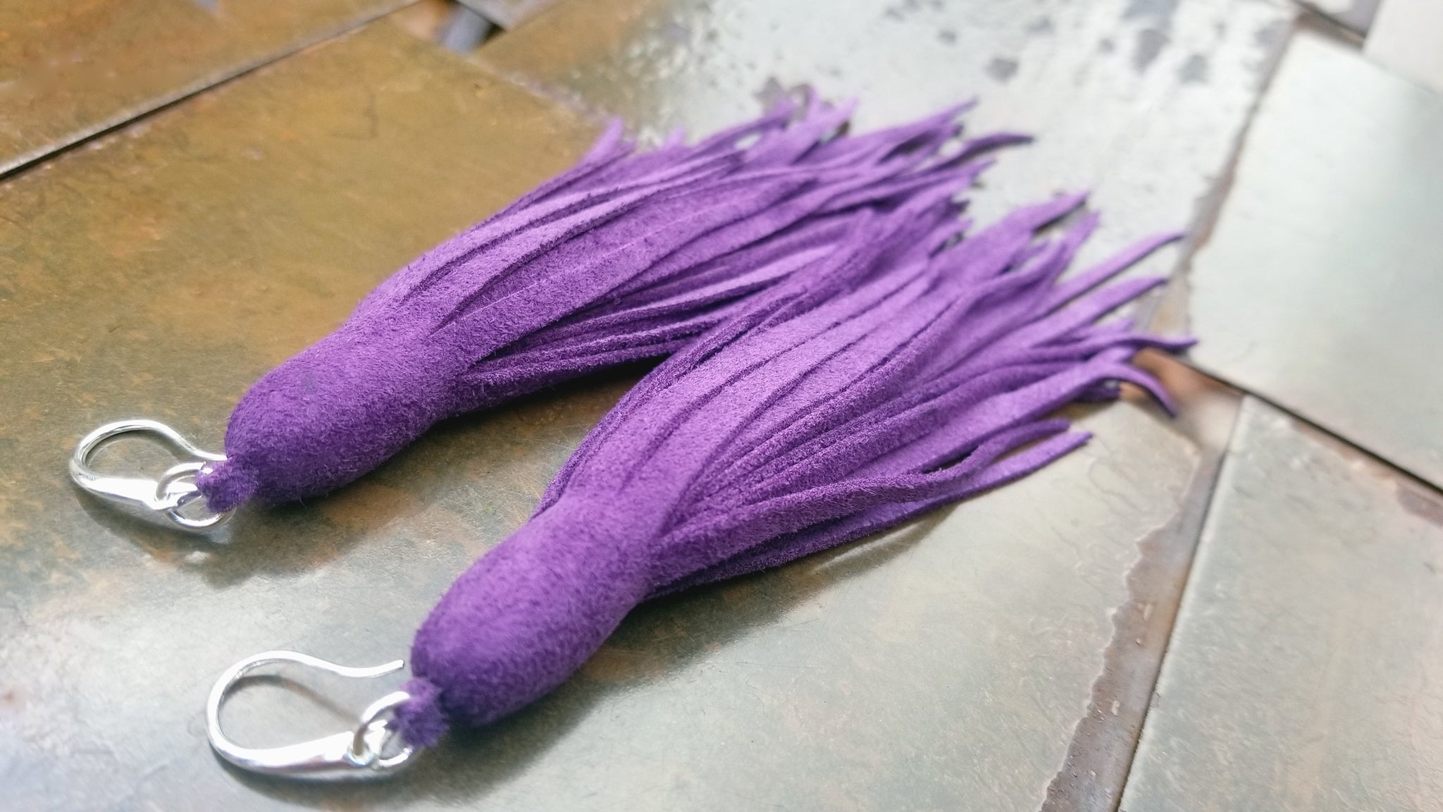 purple goat suede Kimani tassel fringe earrings with silver plated earring latch hooks