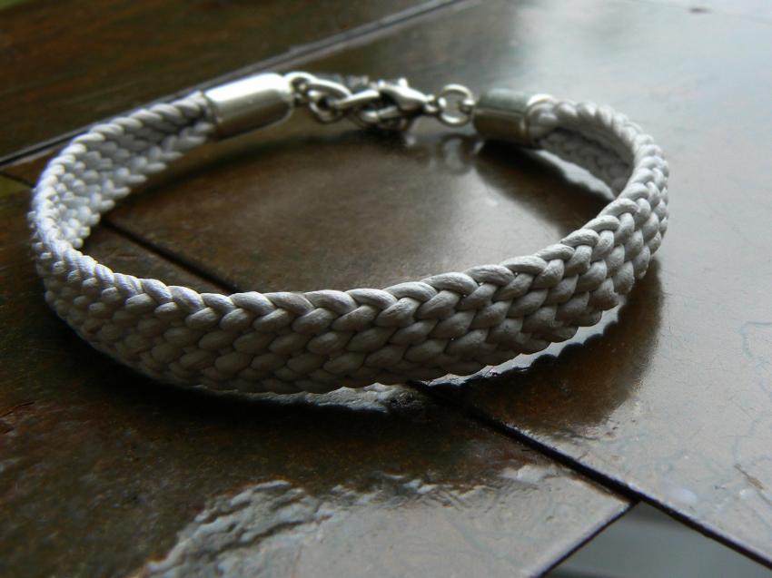 White Yuki hand braided leather bracelet with silver feather charm, lobster clasp and NO silver beads
