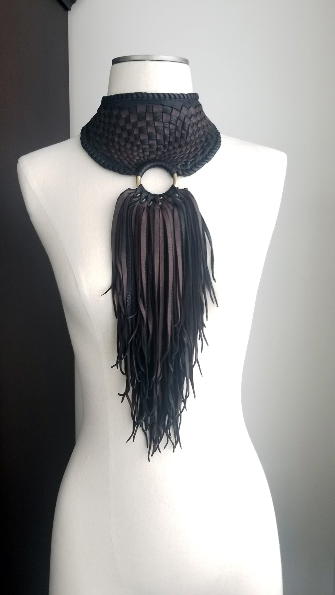 Zanta African Inspired, Braided Leather Statement Necklace, Bib Neckpiece, woven collar, fringe and tassels, on a dress form form