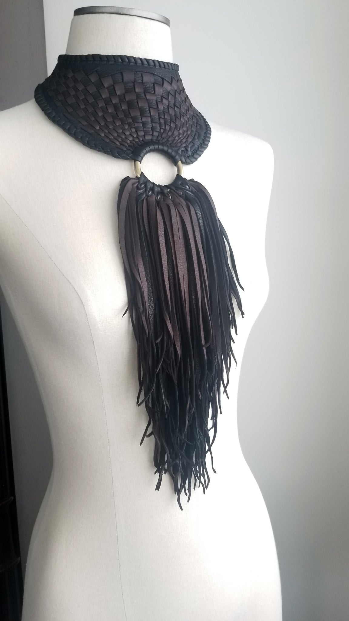 Zanta African Inspired, Braided Leather Statement Necklace, Bib Neckpiece, woven collar, fringe and tassels, on a dress form 