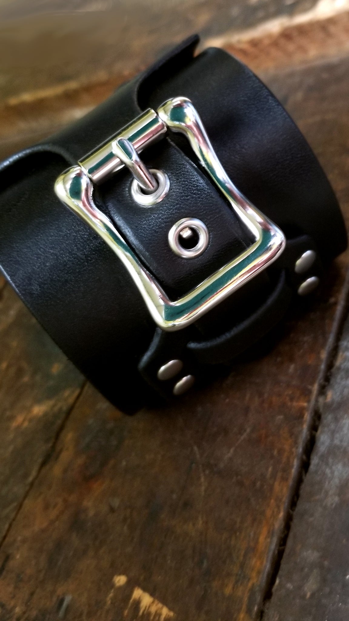 close up of shiny nickel buckle on Aga, Braided Leather cuff, Black
