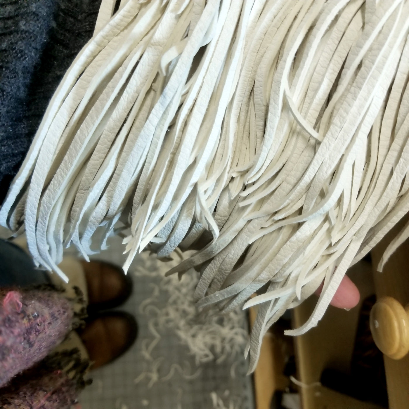 hand cutting the fringe - making a Badu Leather Fringe necklace