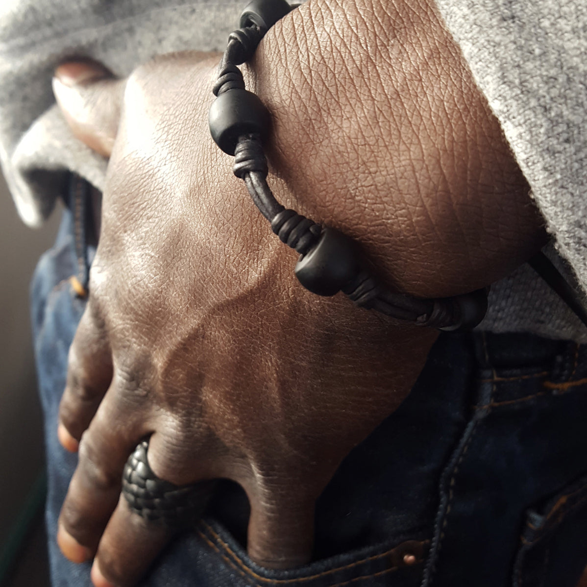 Chuma Leather Bracelet w/ Leather Toggle Button & Loop Clasp Closure, African Trade Bead Bracelet on male model, Men's Women's Knot Bracelet, black onyx