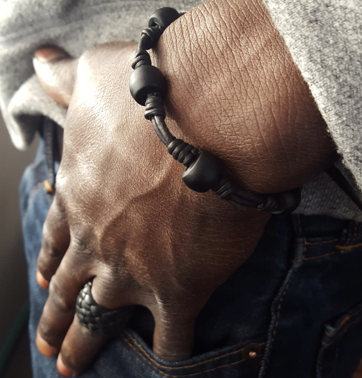 old black African Trade Padre Posser Beads Black Leather Adjustable Stackable Bracelet on male model