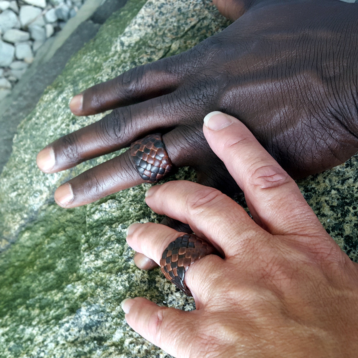 Men's Women's Braided Leather Rings on male and female hands