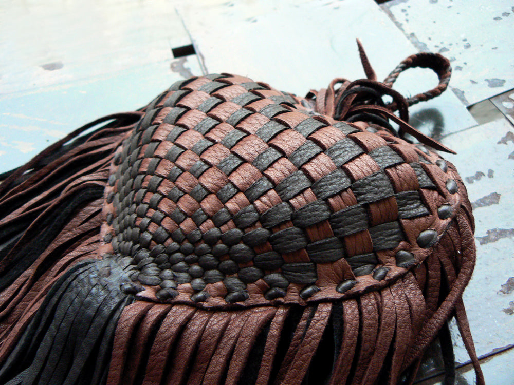 chocolate and mahogany basketweave side of Me Dowappa Leather Hanging pillow - basketweave leather, leather flowers and fringe