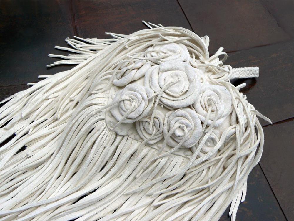 mayonnaise leather roses on Me Dowappa Leather Hanging pillow - basketweave leather, leather flowers and fringe