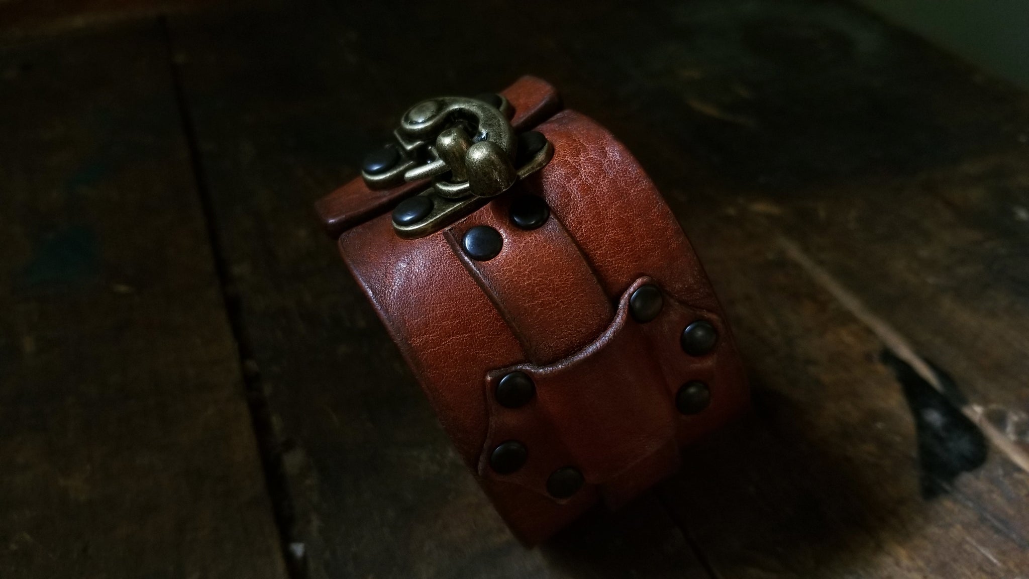 Hook Leather Cuff - Slim. Wide leather snap cuff with antique brass hook & latch in the color tobacco