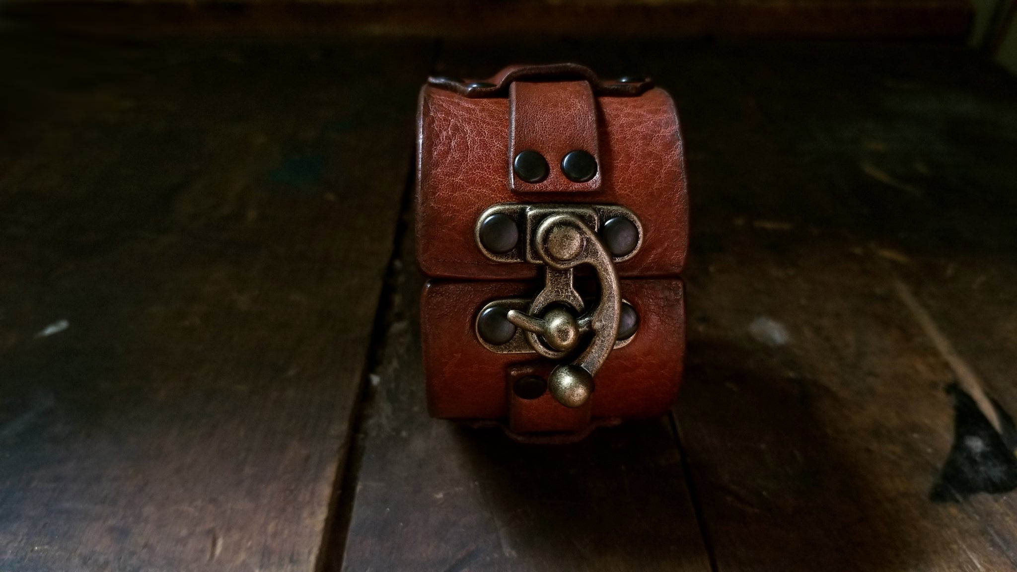 Hook Leather Cuff - Slim. Wide leather snap cuff with antique brass hook & latch in the color tobacco