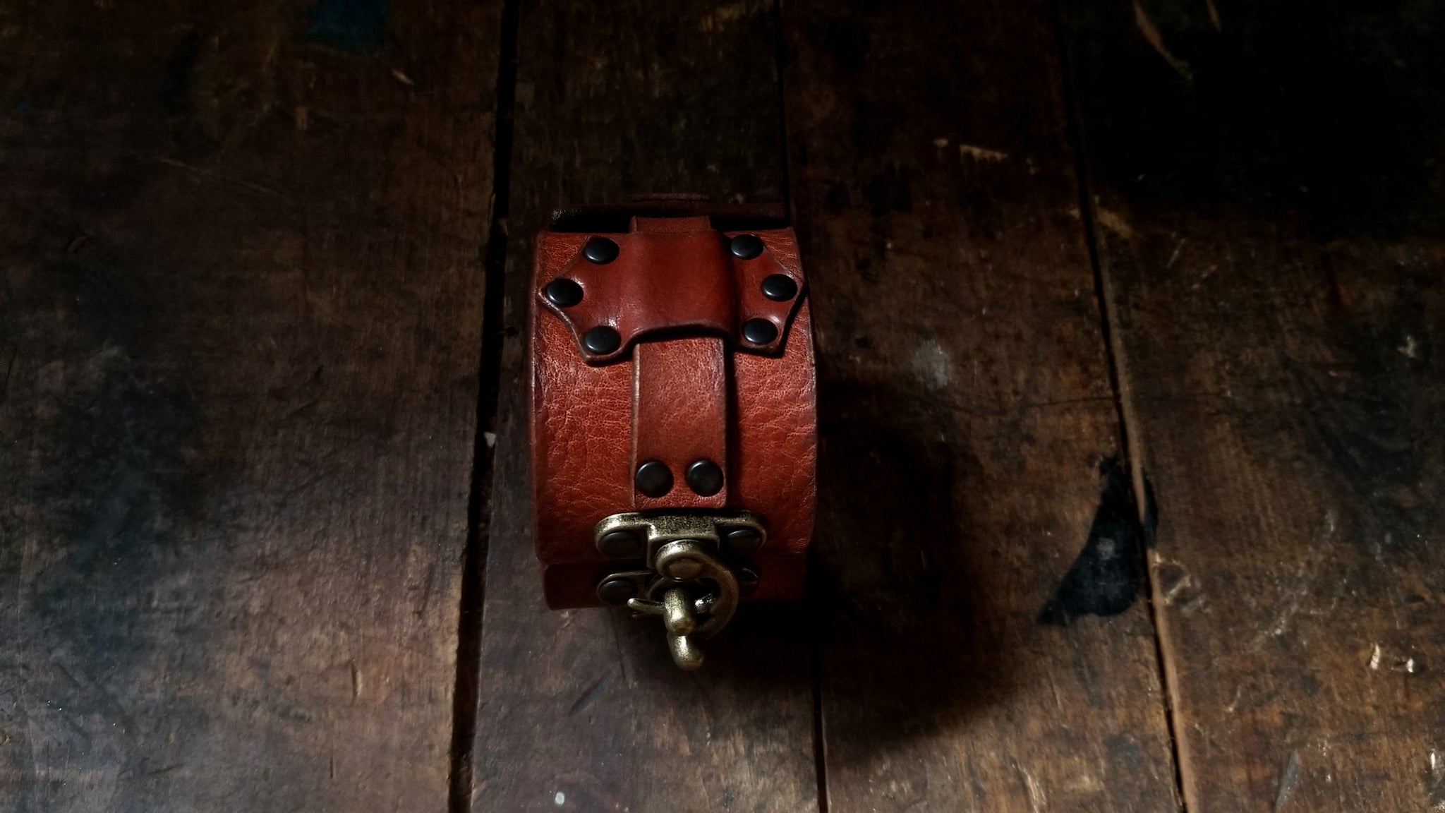 Hook Leather Cuff - Slim. Wide leather snap cuff with antique brass hook & latch in the color tobacco