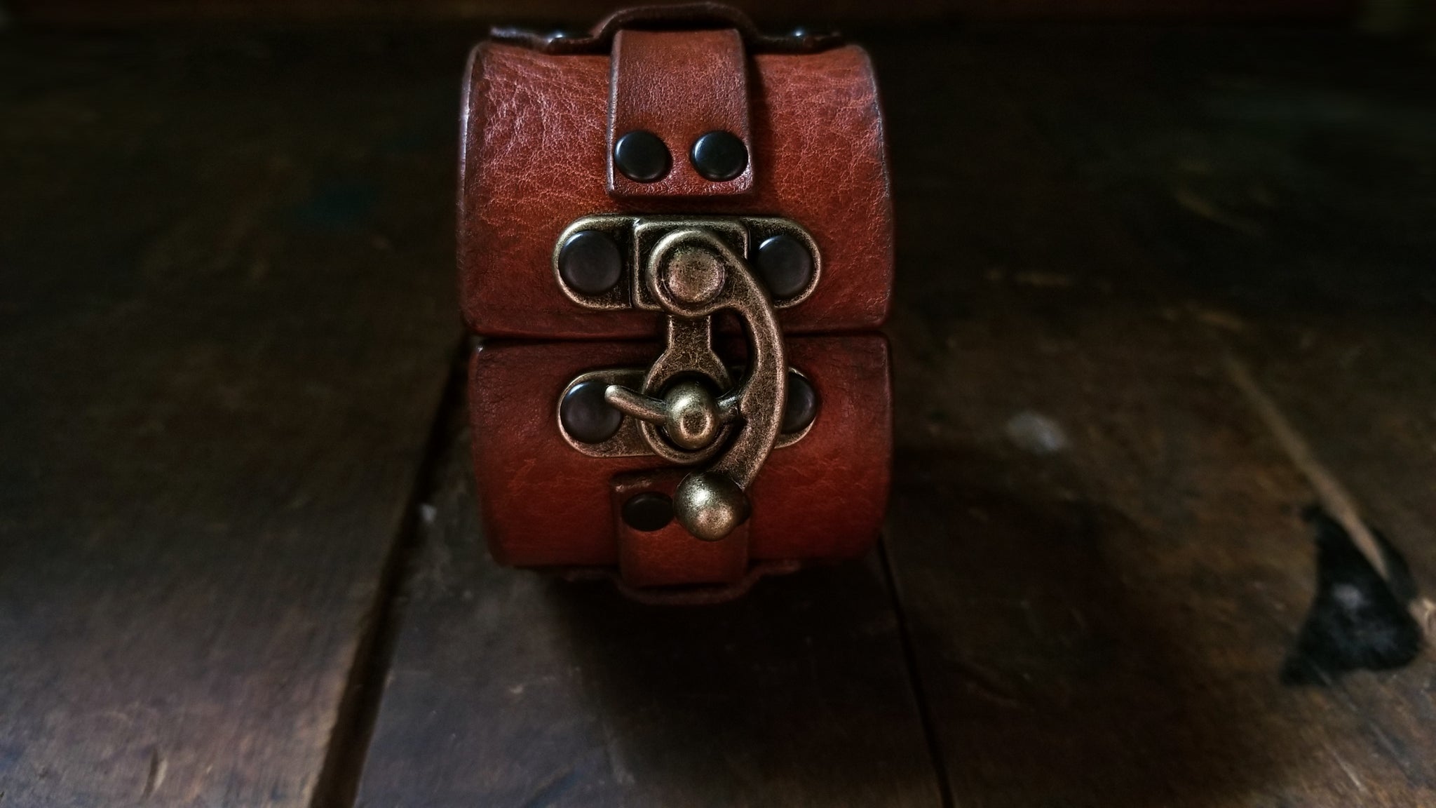 Hook Leather Cuff - Slim. Wide leather snap cuff with antique brass hook & latch in the color tobacco