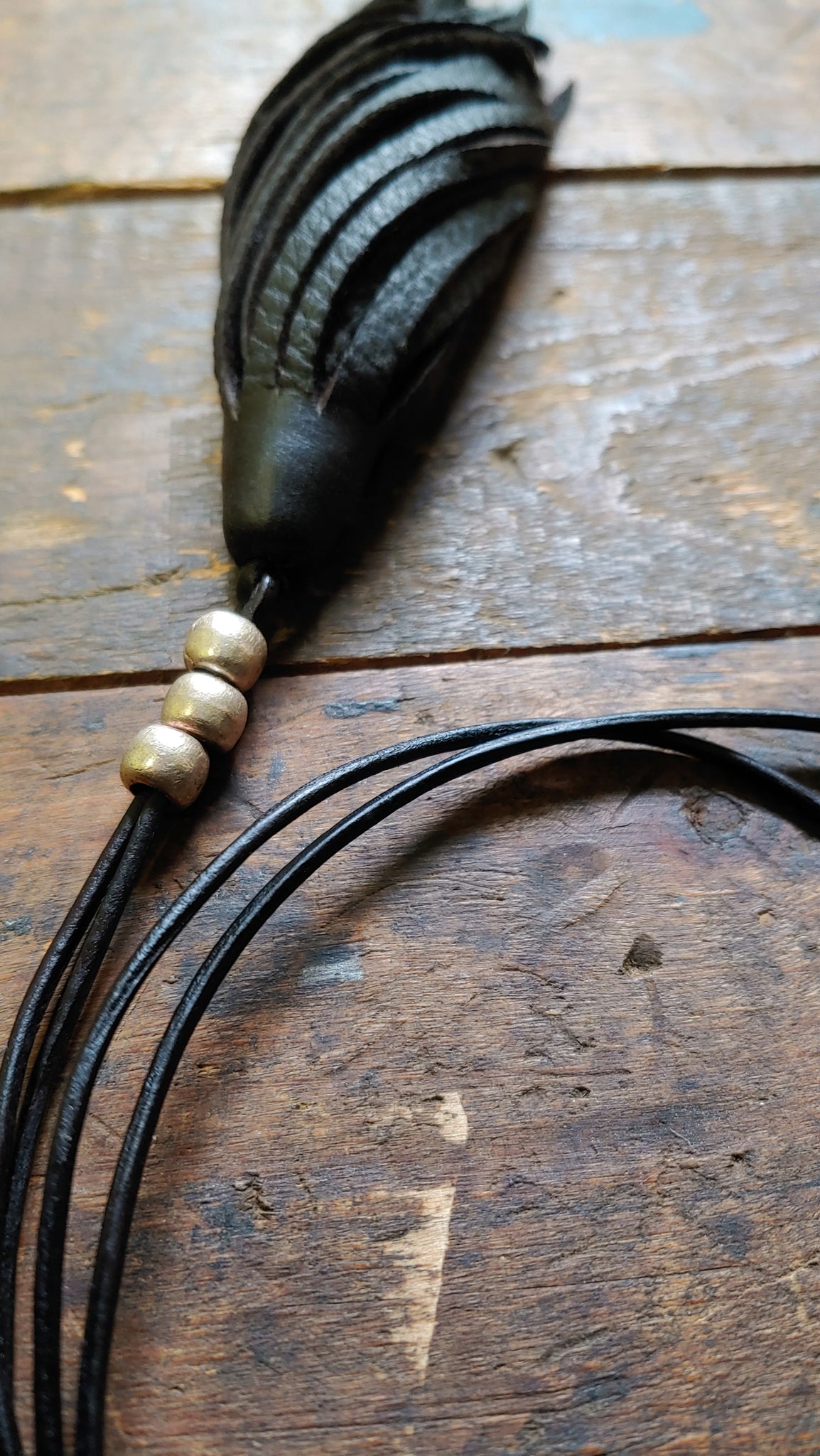 adjustable leather cord necklace with black leather tassel pendant and African beads