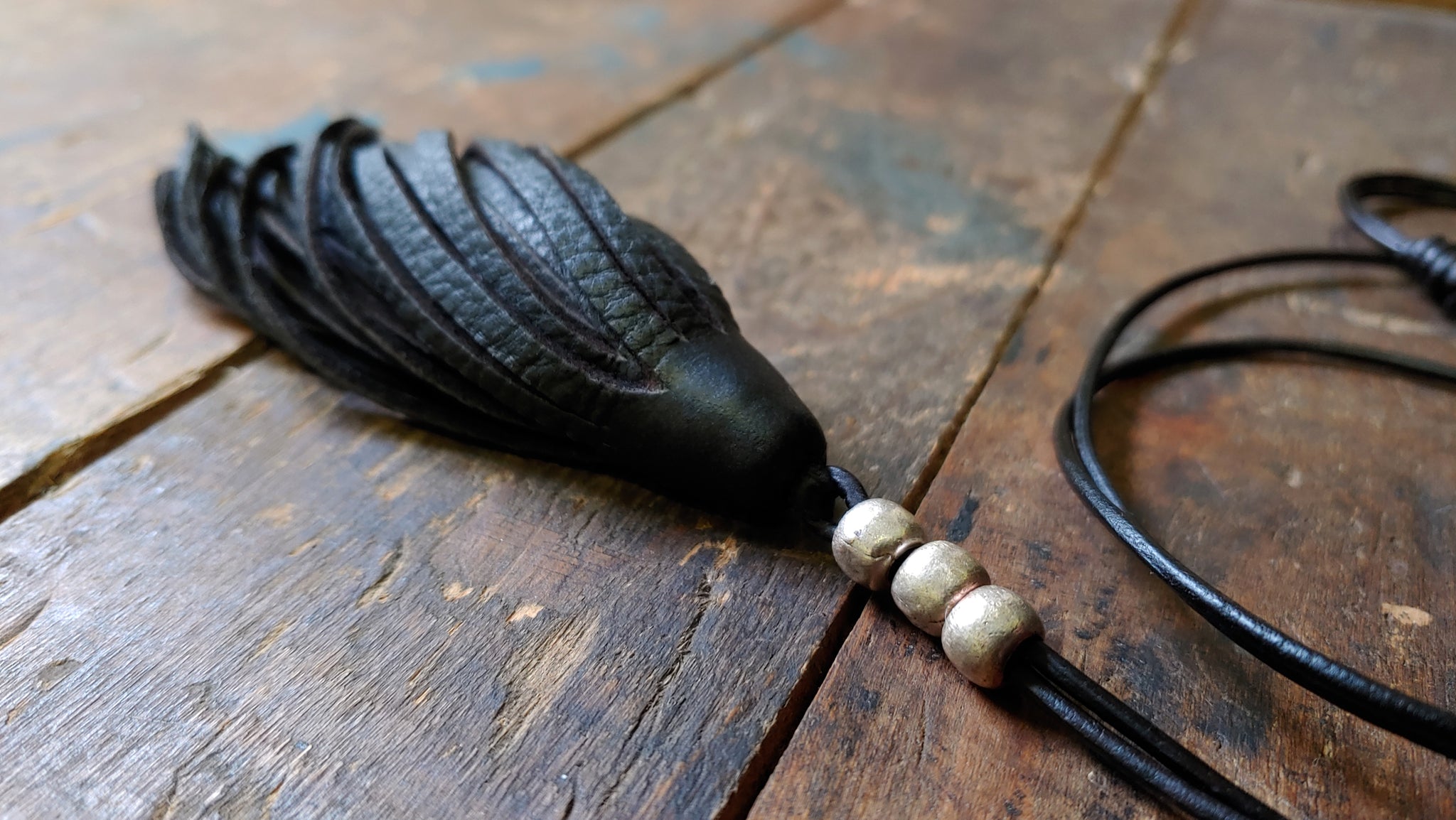 leather tassel pendant necklace, black with African beads in silver