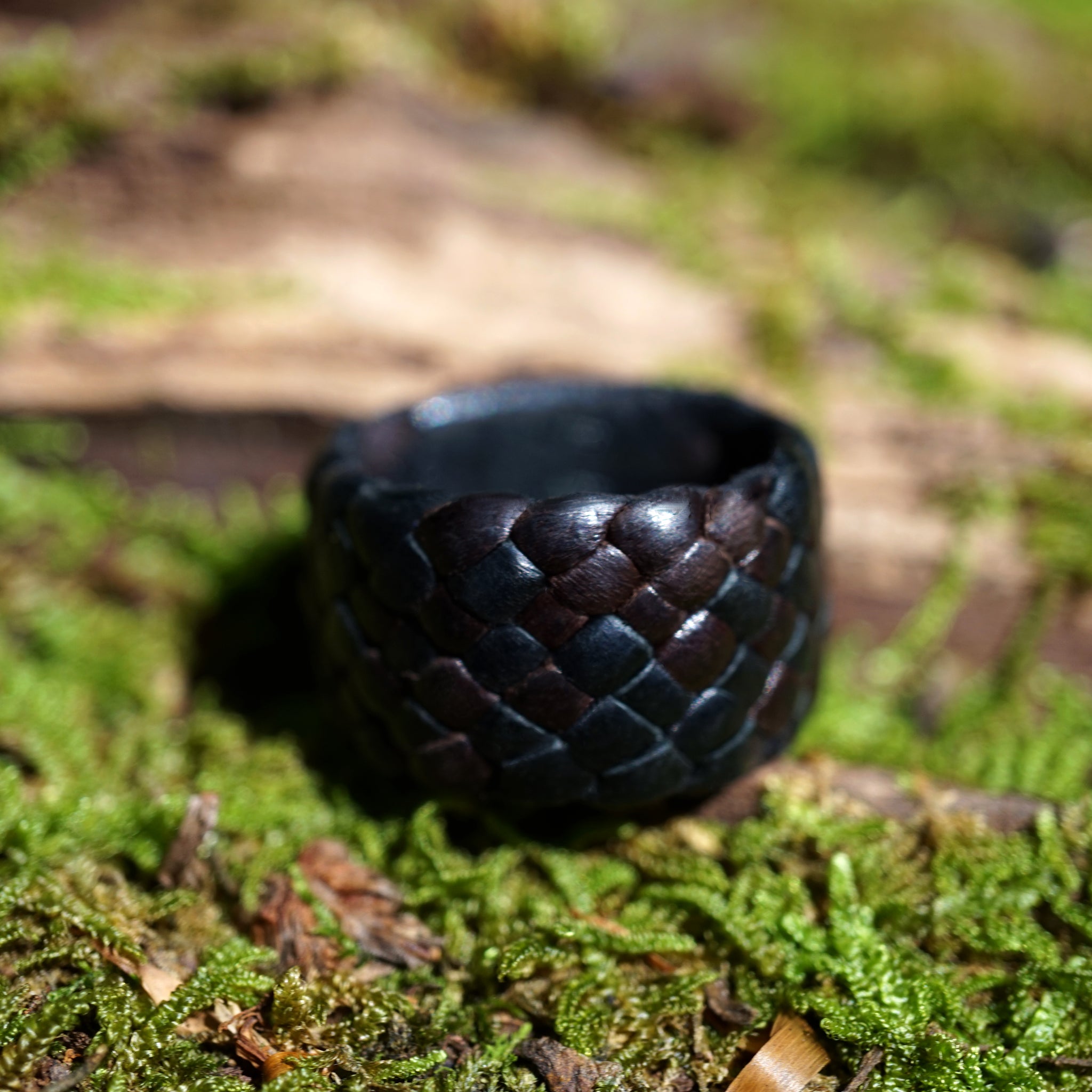 black and chocolate kama braided leather ring 