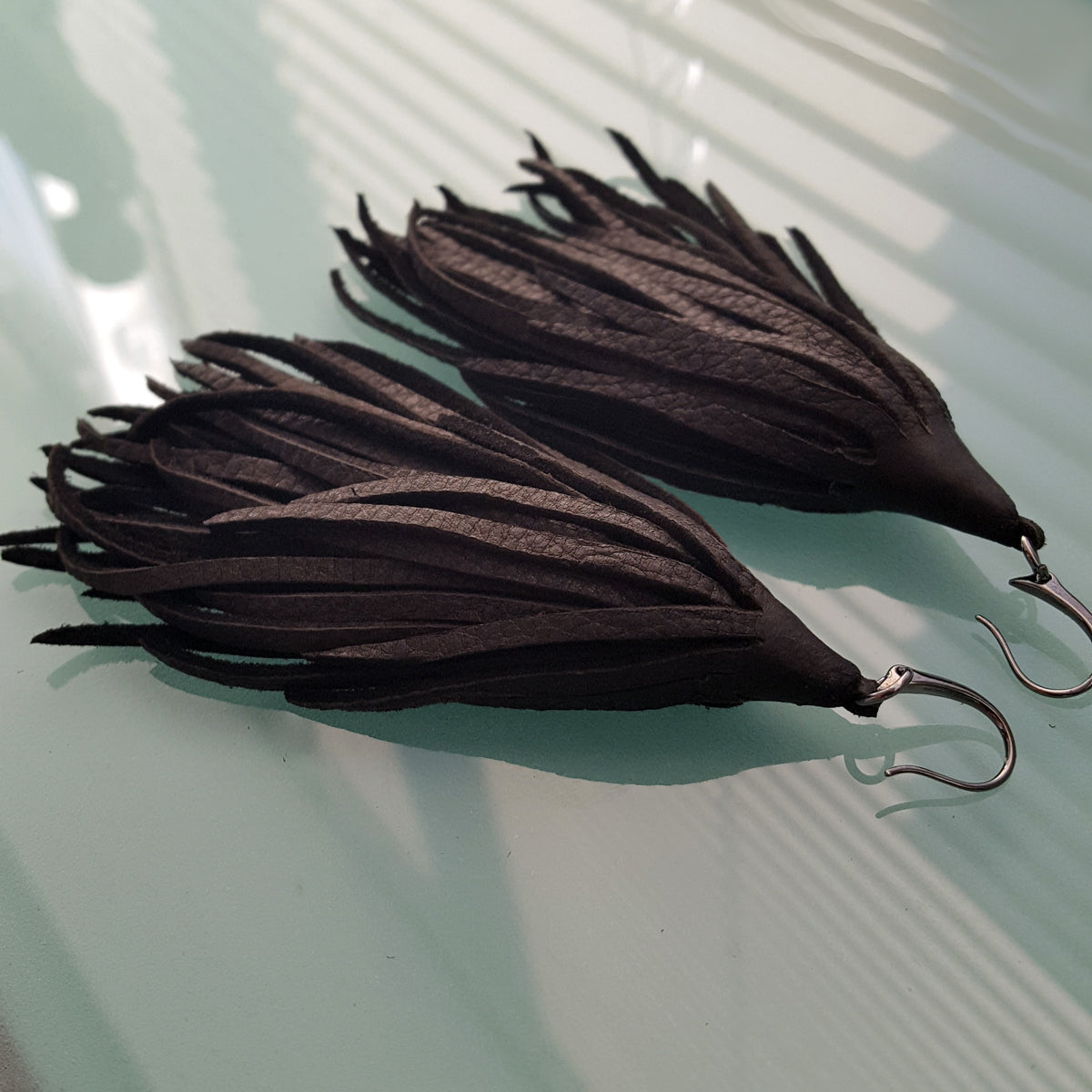 Mini-Mini Kimani Tassel Earrings in black deerskin leather with gunmetal earring hooks