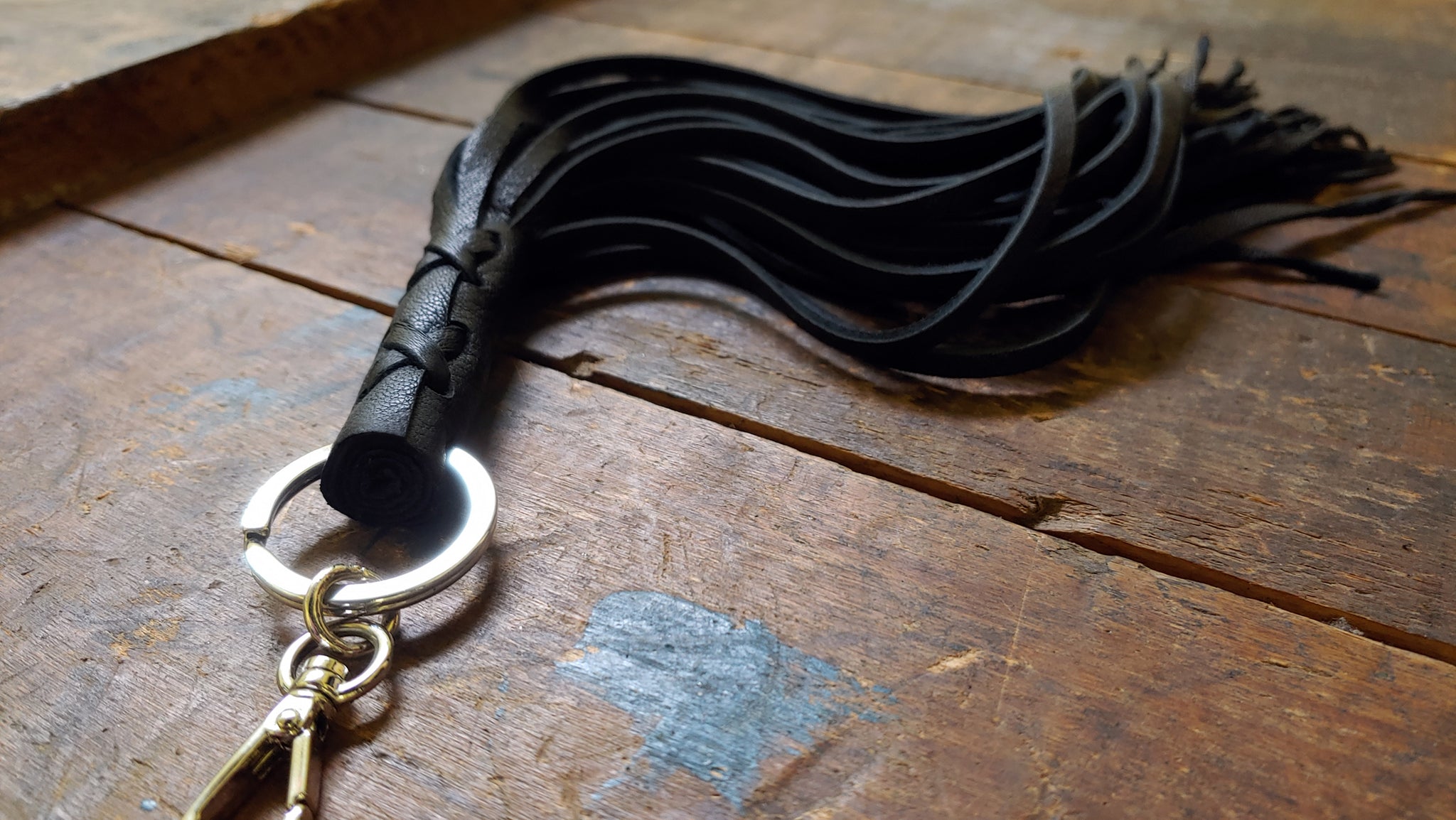 Nala Leather Tassel Key Chain in black deerskin with silver clip