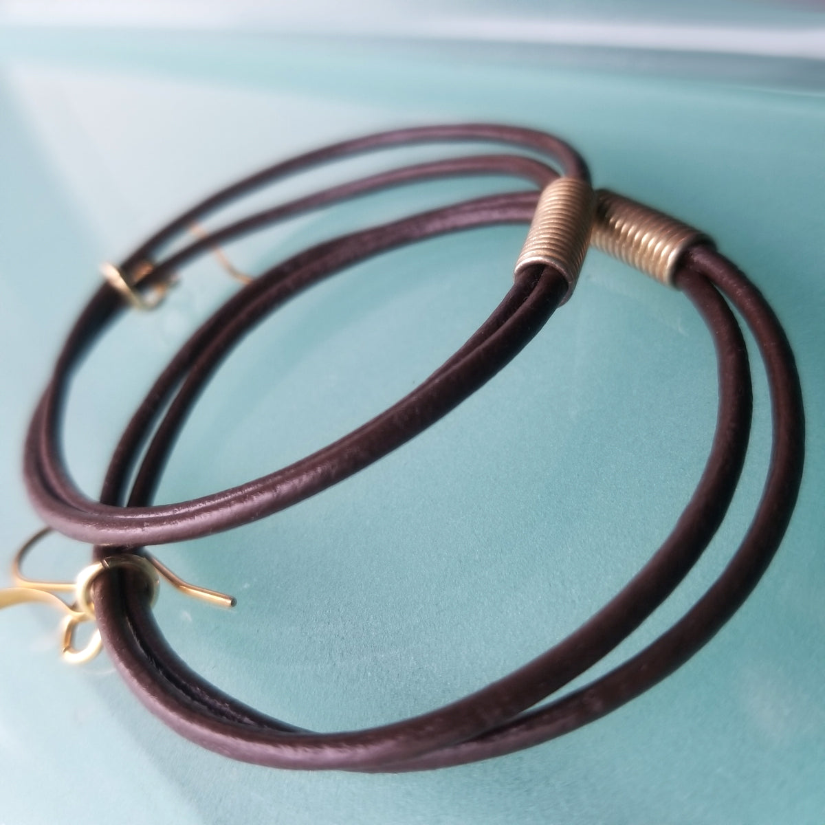 2 mm genuine leather cord hoop earrings in chocolate brown color with gold African Coil Bead